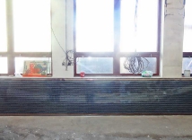 Layout heatflow film on an insulating base wall, fixation